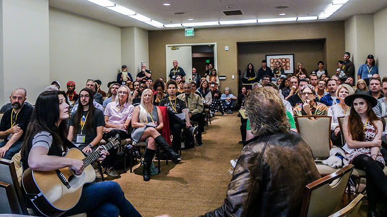 Author Pat Pattison (back of his head) teaches a packed class on lyric writing.