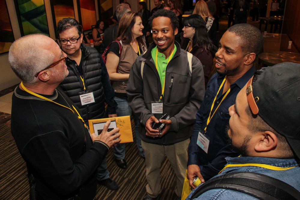 (left to right) Bob Mair (CEO, Black Toast Music) has an impromptu meeting with TAXI members Sergio Naranjo, Chris Hamilton, and Terrell Burt.