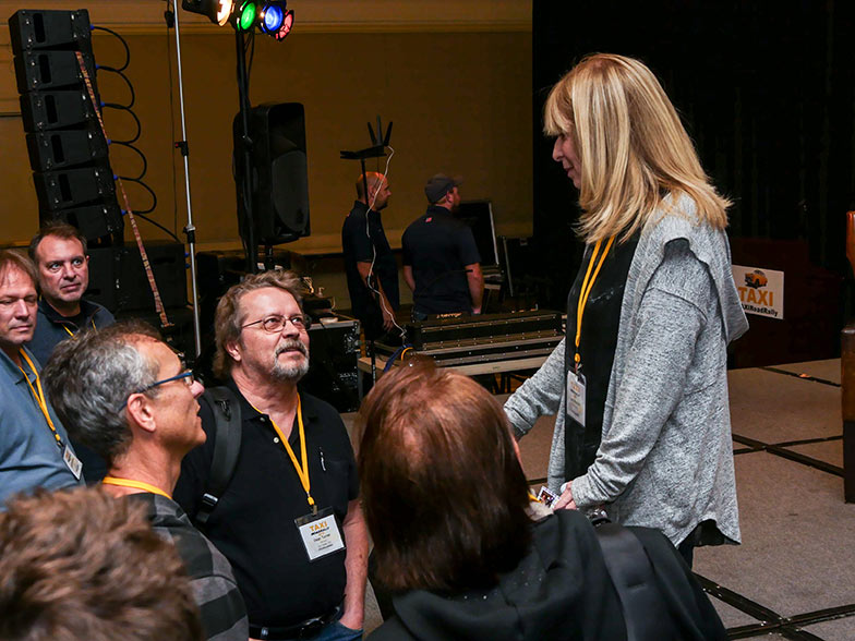 Music library owner Beth Wernick gets to know some TAXI members after her session wrapped up.