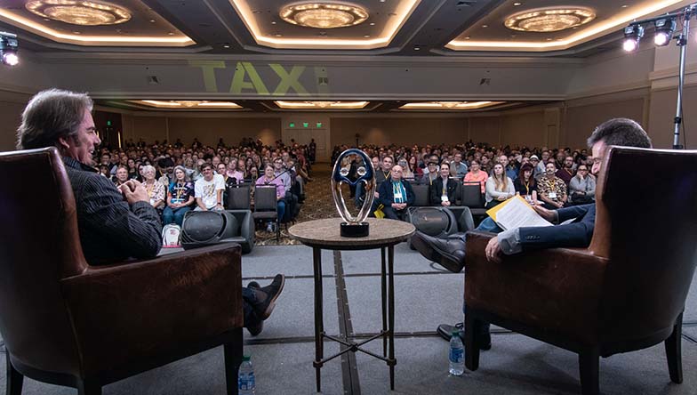 Jonathan Cain (left) seems to be enjoying his Keynote Interview in front of a standing-room-only audience. Cain was TAXI’s Lifetime Achievement Award recipient for 2019.