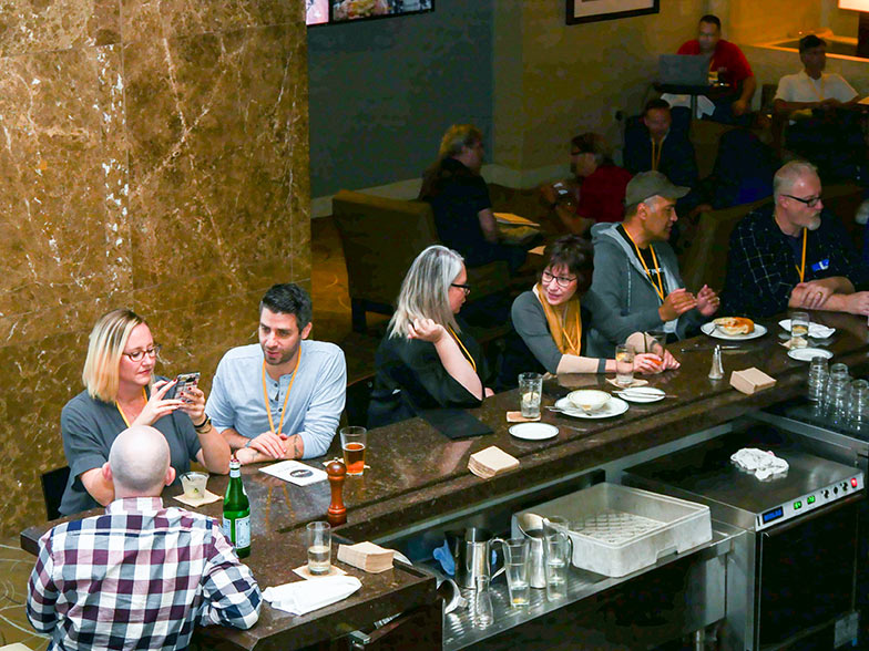 Music supervisor Frank Palazzolo (blue shirt) is undoubtedly talking to the TAXI member in the plaid shirt about the ‘Bama football game. Meanwhile, music licensing executive Shannon Quisenberry is sitting between the two doing what she does best – placing music in TV shows, films, and TV commercials, no matter where she is! The Road Rally is famous for networking, and the lobby bar is networking central. 