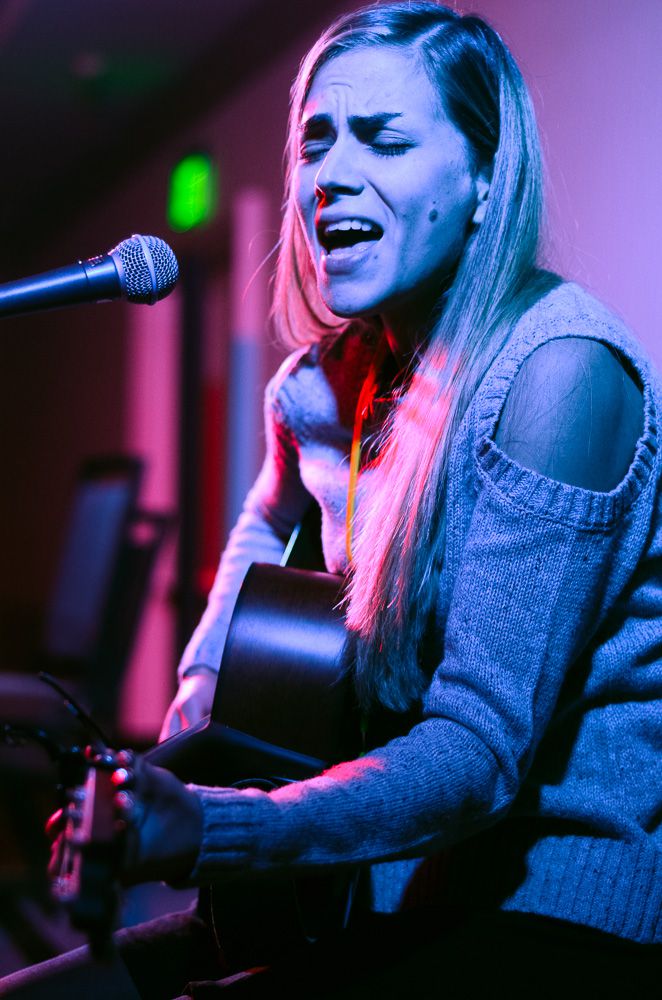 TAXI Member Olivia Bonilla gives a great performance at one of the Open Mics during the Rally.