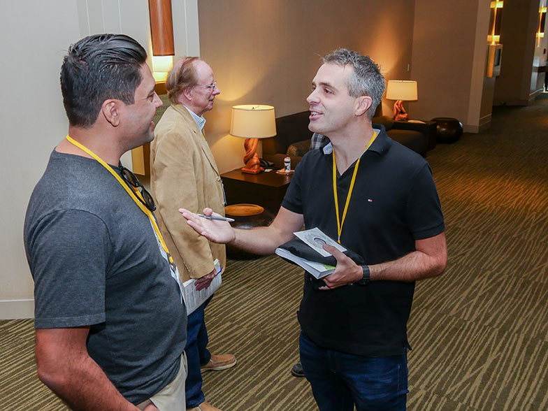 Music library CEO, Michael Kruk spends some time with a TAXI member after his panel at the Road Rally.