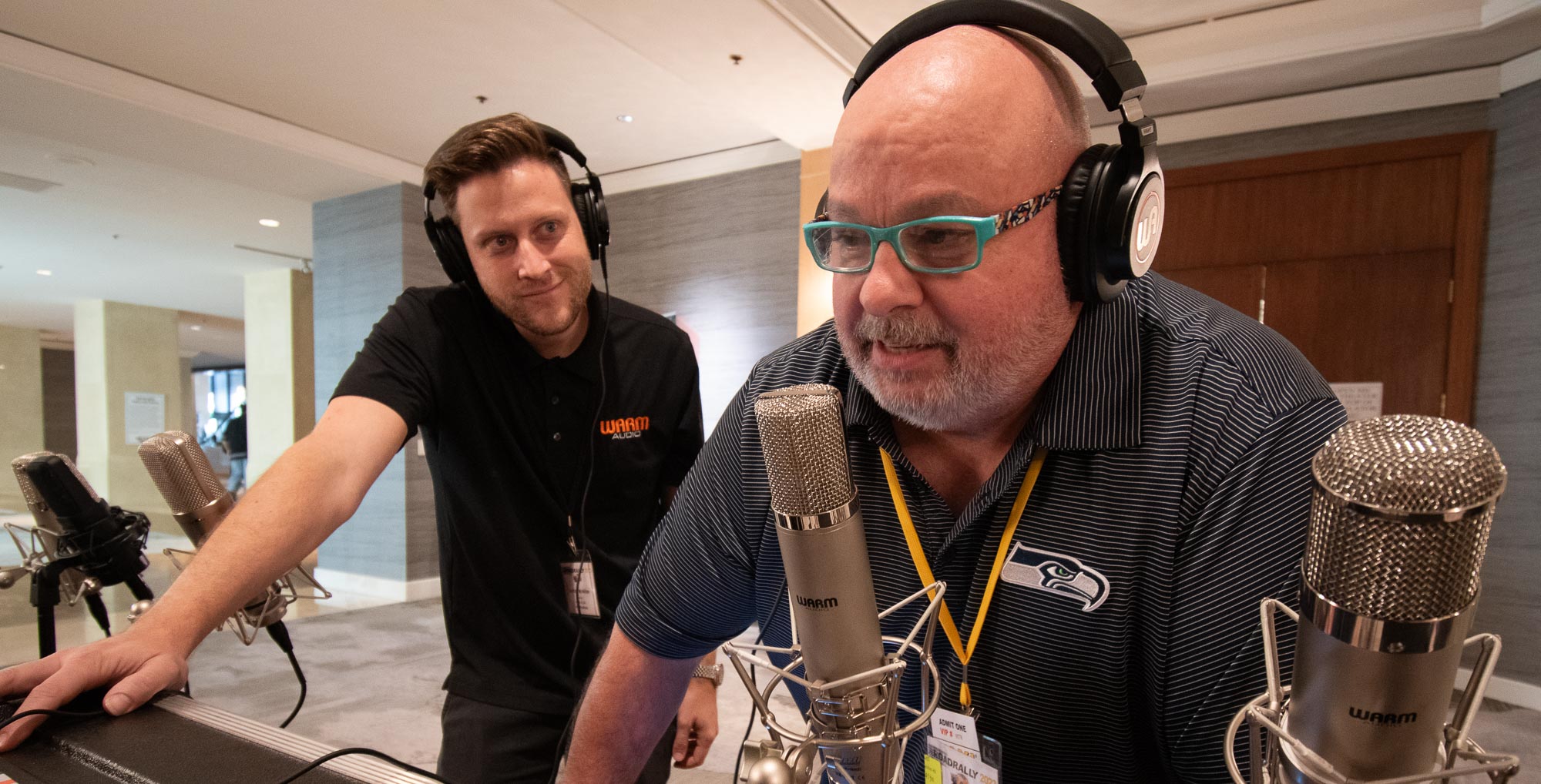 TAXI Member, Reiny Baer, tests some great-sounding microphones while Warm Audio’s, Andrew McMillan, is all smiles based on Reiny’s reaction.